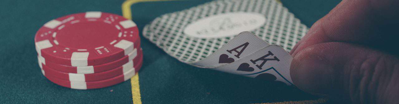 rs8sports hand opening cards with ace king with poker chips